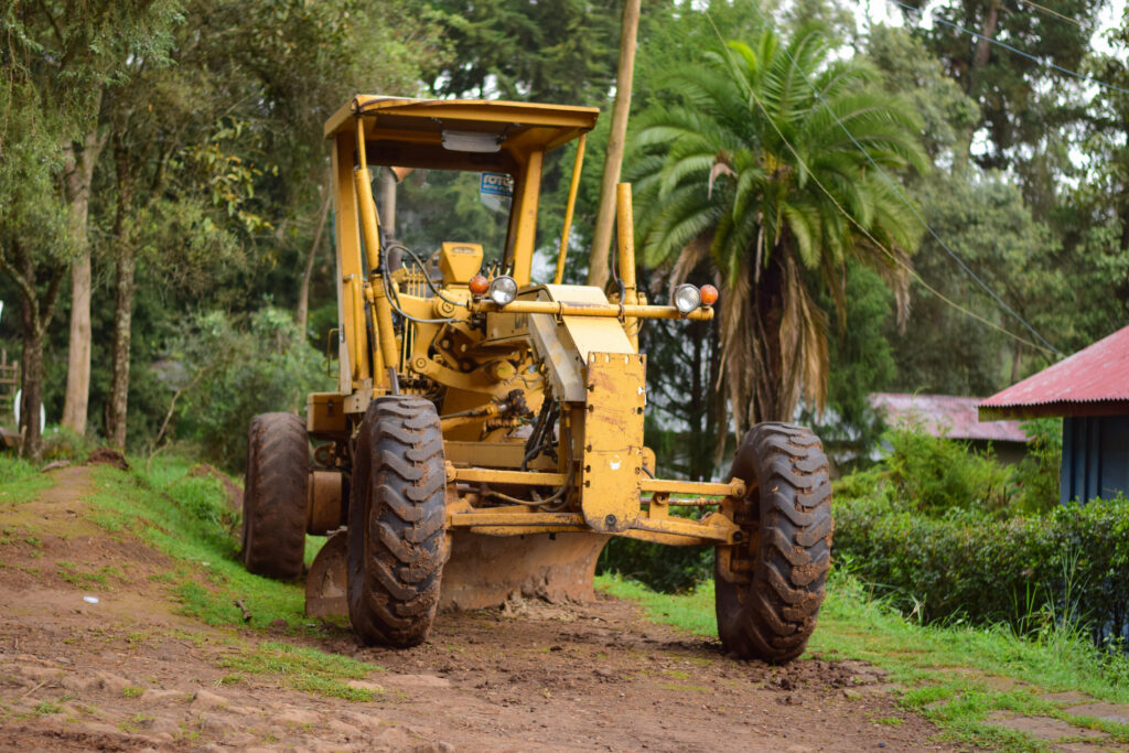 A farm equipment vehicle, tractor cultivating field